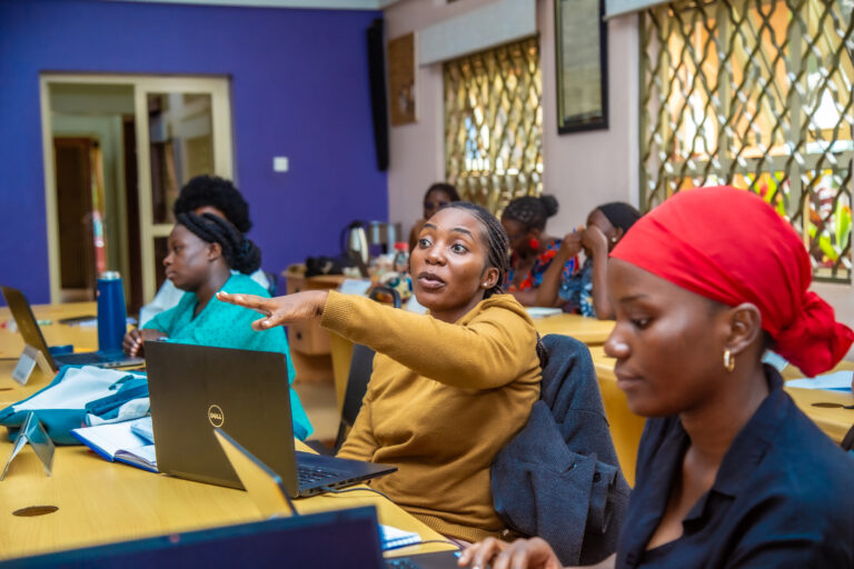 Roy Nakyobe passionately shares an opinion during the AI session